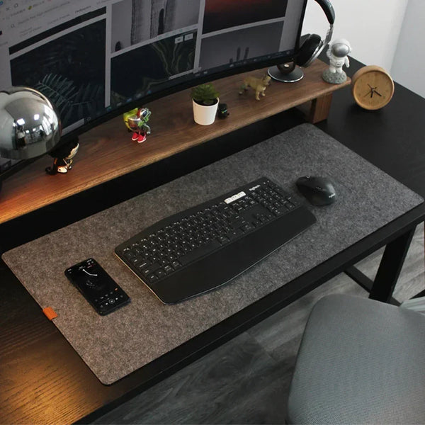 Felt desk mat under a keyboard and mouse