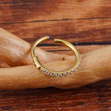 Titanium huggie hoop earring with cubic zirconia