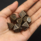 Metal polyhedral dice set in antique bronze