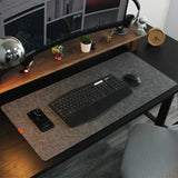 Felt desk mat under a keyboard and mouse