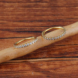 Titanium huggie hoop earring with cubic zirconia