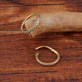 Titanium huggie hoop earring with cubic zirconia
